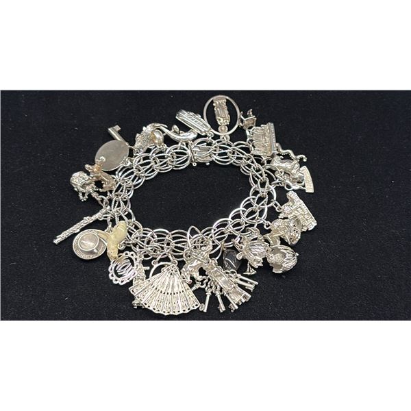 APPROX 10K CHAIN (17") WITH APPROX 10K PENDANT (3.7G) & SILVER CHARM BRACELET WITH MULTIPLE SILVER