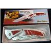 Image 1 : 299. Frost Cutlery Zeppelin Folder Knife 5" Silver Composite  Handle with Red Inserts.