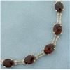 Image 2 : Fancy Checkerboard Cut Garnet And Diamond Bracelet in 10k Yellow Gold