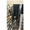 Image 1 : STACK OF 20 BLACK PLASTIC METAL FRAMED STACKING CHAIRS WITH MOBILE CHAIR CART