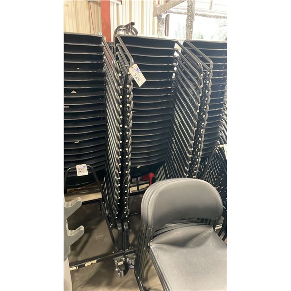 STACK OF 20 BLACK PLASTIC METAL FRAMED STACKING CHAIRS WITH MOBILE CHAIR CART
