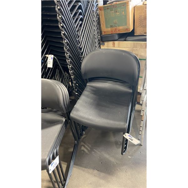 STACK OF 20 BLACK PLASTIC METAL FRAMED STACKING CHAIRS