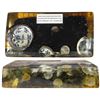 Image 1 : Large resin block containing four Dutch silver ducatoons, four Chinese porcelain shards, four musket