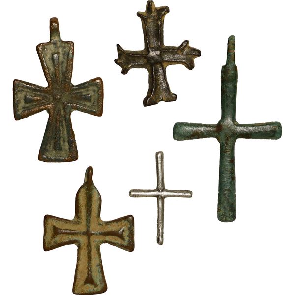 Lot of five small Byzantine crosses (four copper and one silver), ca. 7th to 11th centuries AD.