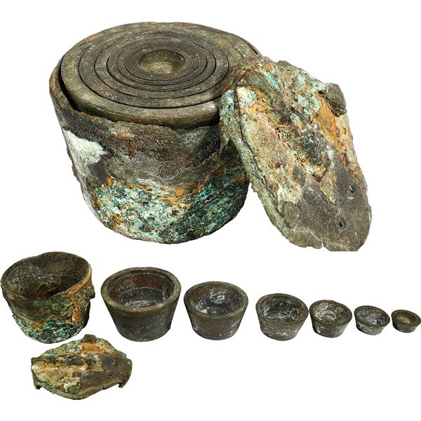 Small brass nested weight set consisting of six cups and case.