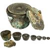 Image 1 : Small brass nested weight set consisting of six cups and case.