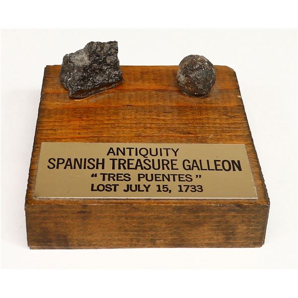 Lead musketball and small piece of ballast stone on a wooden display with plaque, ex-1733 Fleet ("Tr