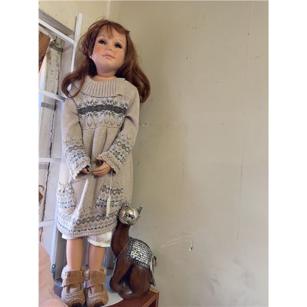 Large Porcelain Doll With Brown Hair Wearing Sweater Dress And Brown Boots
