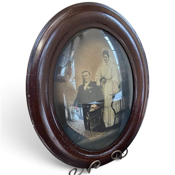 Oval Framed Black-and-White Wedding Photograph with Easel Stand