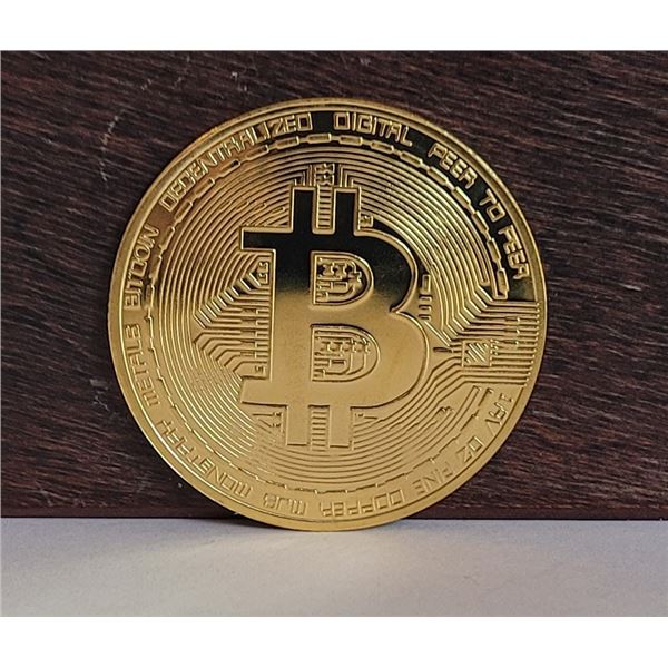 12)  GOLD TONE BITCOIN TOKEN.