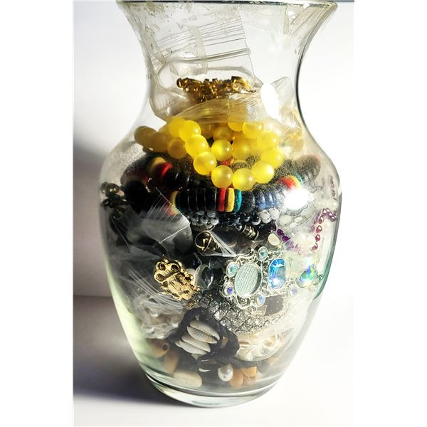 16)  CLEAR 8" VASE CONTAINING