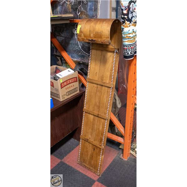 WOODEN TOBOGGAN SLED WITH A CURVED HOOD