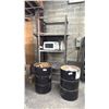 Image 1 : 2 BLACK METAL BARRELS WITH ASSORTED SCRAP METAL & METAL SHELVING UNIT WITH MICROWAVE
