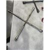 Image 2 : 2 TIRE WRENCHES AND A STEERING WHEEL LOCK WITH KEY