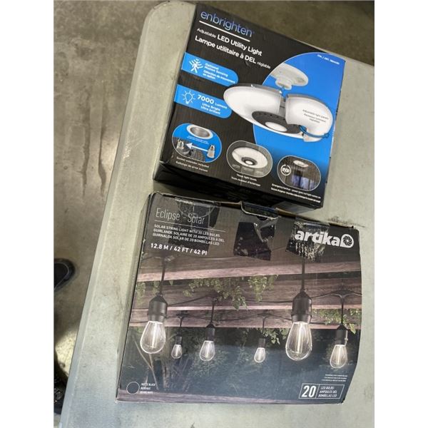 ENBRIGHTEN ADJUSTABLE LED UTILITY LIGHT AND BOX OF ARTIKA ECLIPSE LED STRING LIGHTS