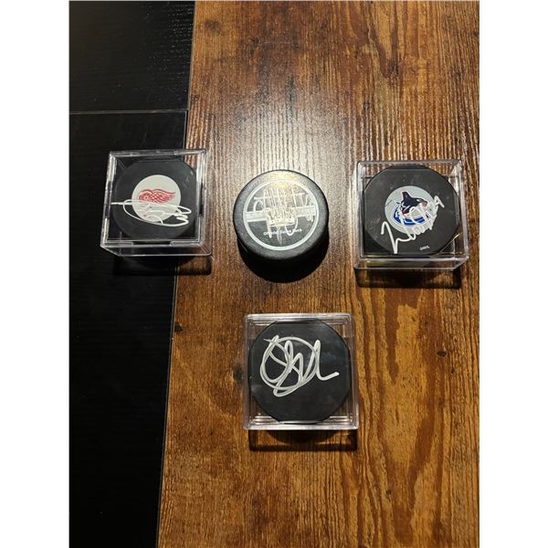 4 Autographed NHL Hockey Pucks