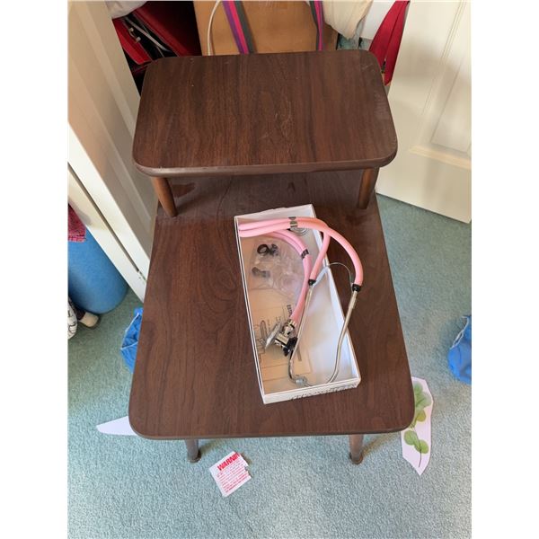 Closet Contents Including Table, Pink Stethoscope, Water Bottle, Hangers, and Bags