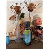 Image 11 : Wood and Glass Shelf Unit With DVDs, Remote Controls, Plush Tiger, and Decor Items