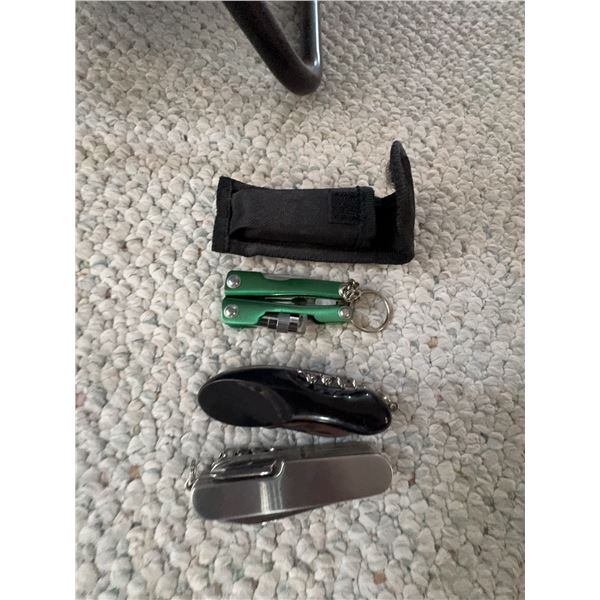 Three Multi-Tools with Black Case, Including Swiss-Style Pocket Knives