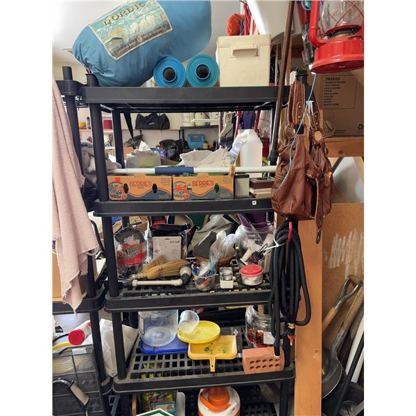 Household and Garage Items Including Sleeping Bag, Cooler, and Storage Bins