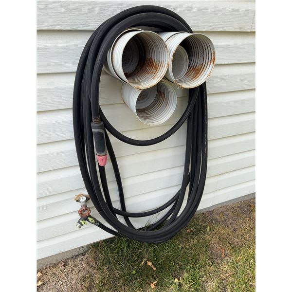 Welding Torch With Hoses and Wall-Mounted Storage