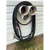 Image 1 : Welding Torch With Hoses and Wall-Mounted Storage