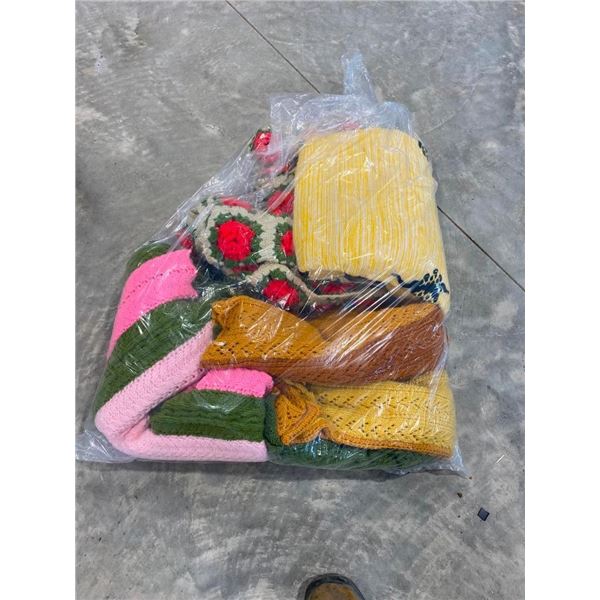 BAG OF ASSORTED KNITTED BLANKETS