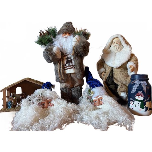 Christmas Decorations Including Santa Figures, Nativity Scene, and Snowman Jar