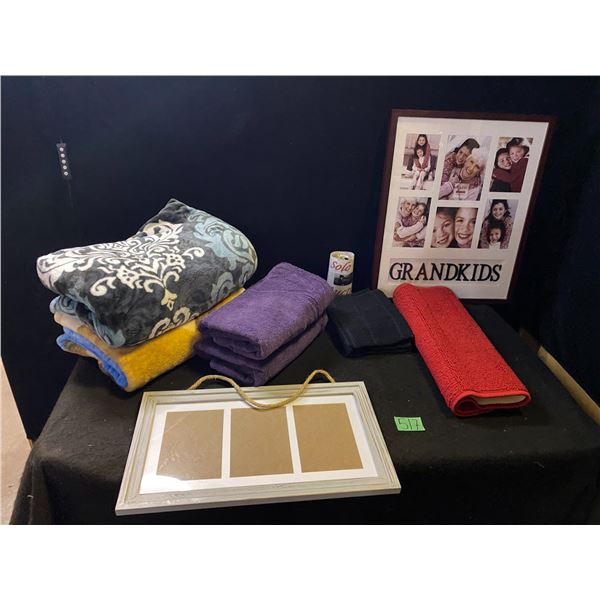 Lot of household items including picture frames, throw blankets, towels and more