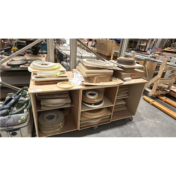 LARGE GROUP OF ASSORTED EDGE BANDING MATERIAL, 2 CABINETS & 2 DOLLYS INCLUDED