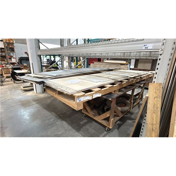 2 LARGE WOODEN MOBILE SHOP TABLES WITH ASSORTED COUNTERTOP STONE MATERIAL & LAMINATE SHEETS