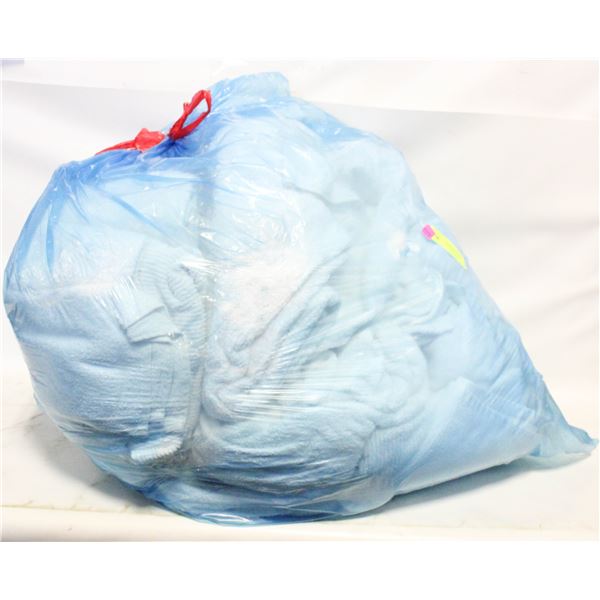 LARGE CLEAR BAG FULL OF WHITE TOWELS