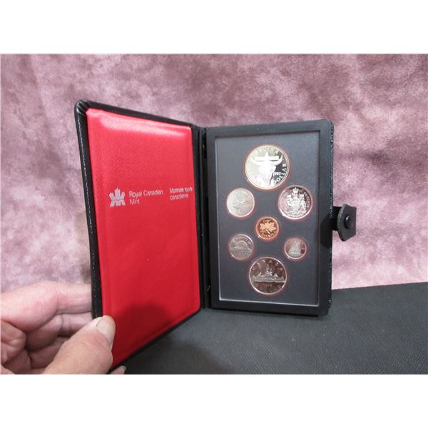 1982 - 7 coin specimen set[?] cased, missing card description.