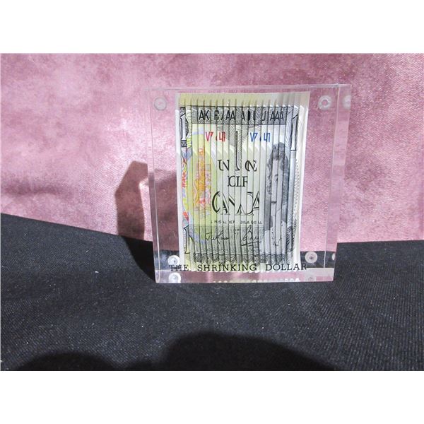 The Shrinking Dollar -  Canadian 1 dollar bill in acrylic block