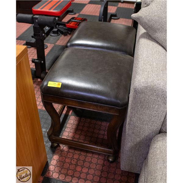 PAIR OF LEATHER AND WOOD STOOLS ON CASTORS