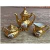 Image 1 : Gold Gilt Japanese Porcelain Tea Set: Teapot, Sugar Bowl, Creamer, Courting Scene