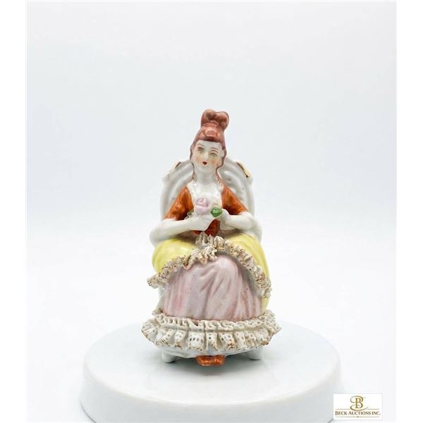 Porcelain Figurine of Seated Lady in Detailed Dress