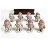 Image 1 : 8 Porcelain Girl Figurines in Winter Clothing