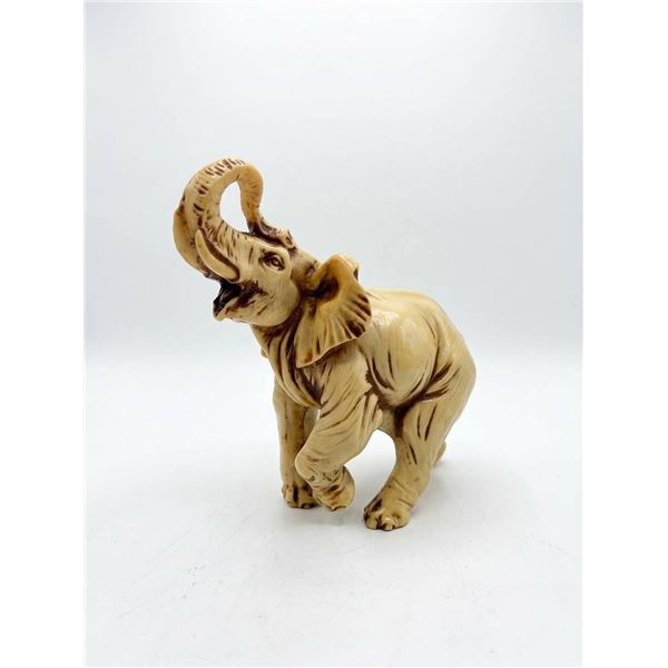 Carved Resin Elephant Figurine with Upturned Trunk