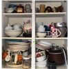 Image 1 : Cabinet Full of Assorted Kitchen Cups, Plates, Bowls, Mugs, and Storage Containers