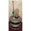 Image 1 : Blue and Gold Snare Drum, 7UP Bottle, and Carved Wood Sculpture Under Glass Dome
