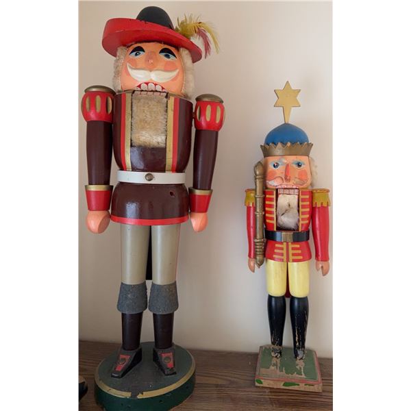 Wooden Nutcracker Figures with Painted Details and Feather Accent