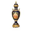 Image 2 : Spanish Sèvres. Three Cobalt Blue Porcelain Vases with Gilded Accents and Painted Scenes