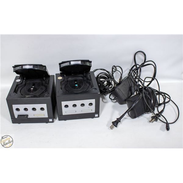 TWO BLACK GAMECUBES WITH MEMORY CARD AND CABLES