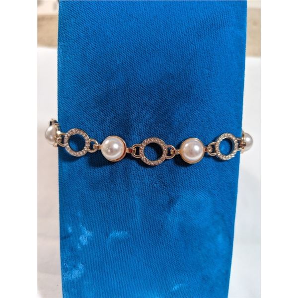 GOLD PLATED W/ PEARLS DESIGNER BRACELET, BLACK LEATHER W/ BUCKLE, MARKED WD 051