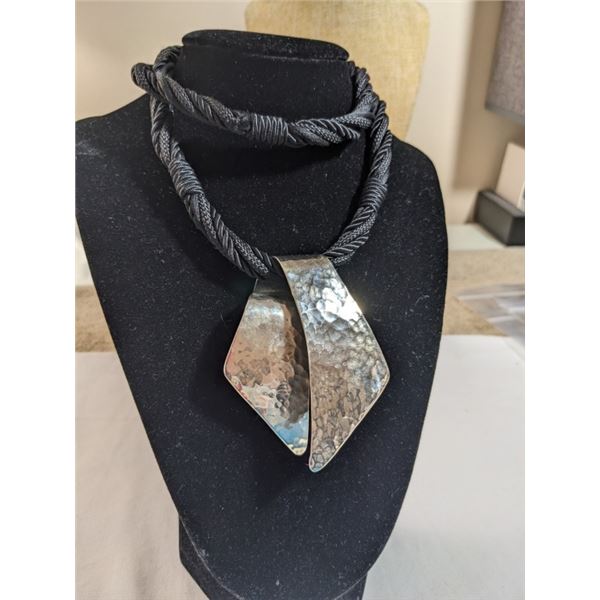 HAND HAMMERED SILVER PENDANT, MARKED HAND WRITING LIVING STONE W/ BLACK CORD NECKLACE