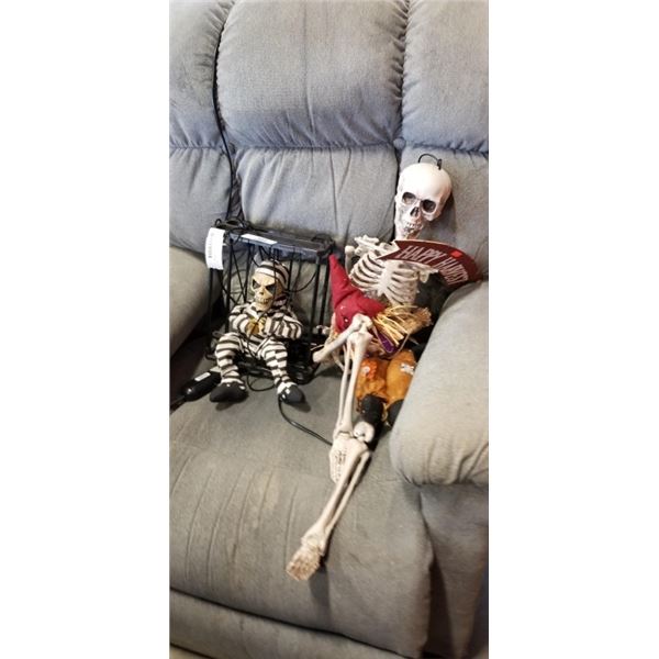 2 HANGING SKELETONS AND A HANGING SCARECROW