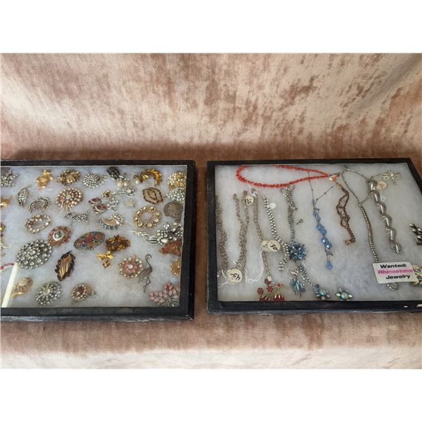 Rhinestone Brooches and Costume Jewelry with Bracelets and Necklaces in Display Cases
