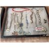 Image 3 : Rhinestone Brooches and Costume Jewelry with Bracelets and Necklaces in Display Cases