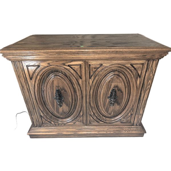 Carved Wood Cabinet with Ornate Brass Handles and Double Doors